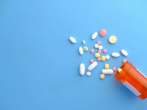 orange and white medication pill